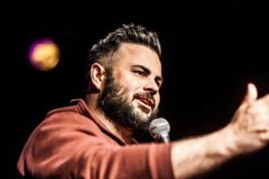 Brendan Eyre Performing Stand up Comedy for a Live Audience