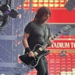 Foo Fighters Performing Live at a Corporate Concert As a Rock Band